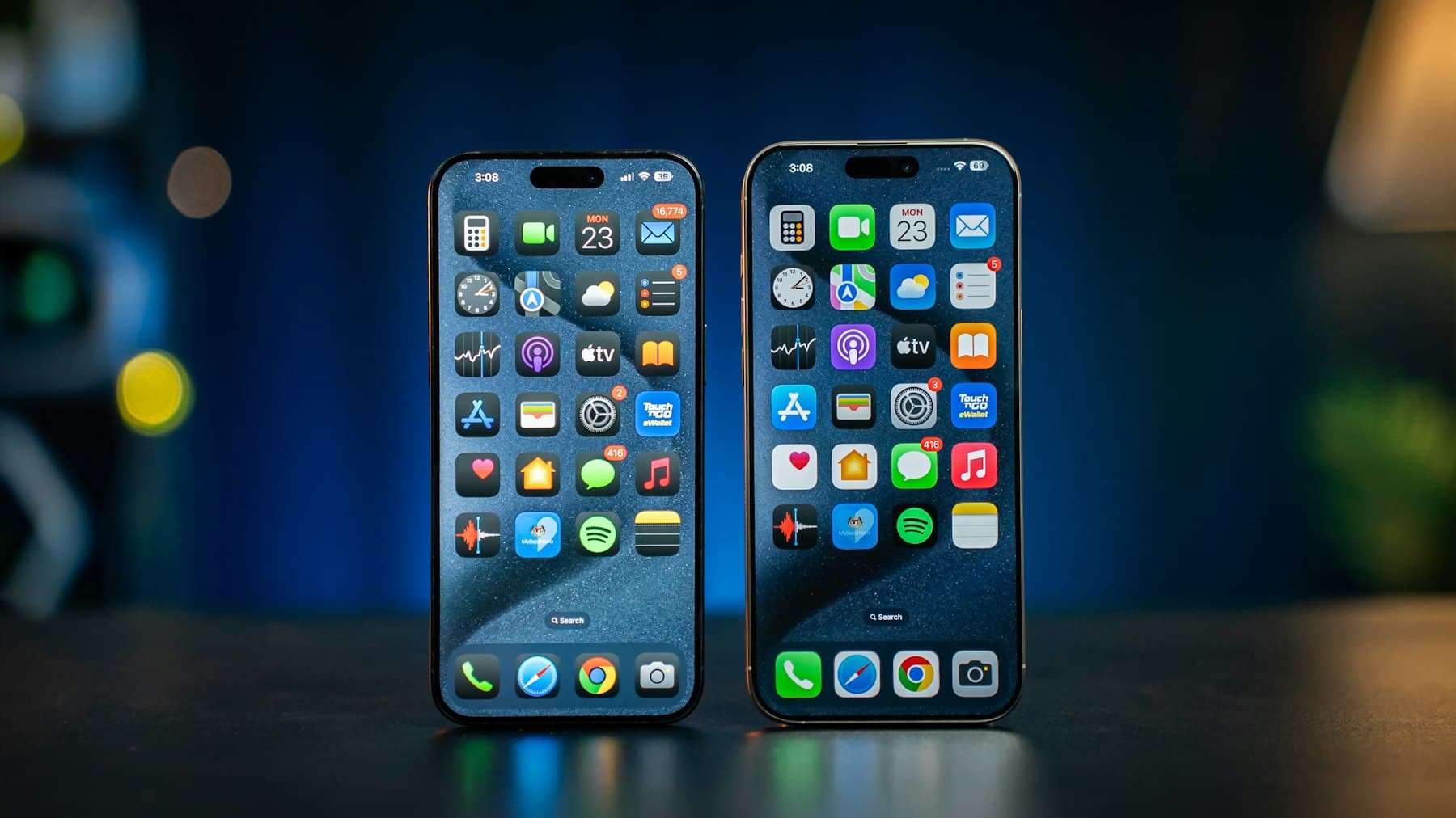 Two current iPhones side by side, home screens lit
